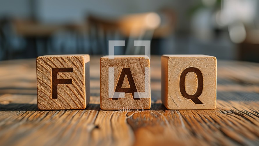  Wooden blocks spell FAQ on table
