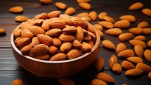 Almond nuts in a wooden bowl on a dark wooden background.