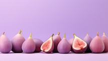 Ripe figs on purple background with copy space. Healthy food concept.