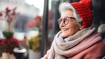 happy senior woman in eyeglasses and scarf