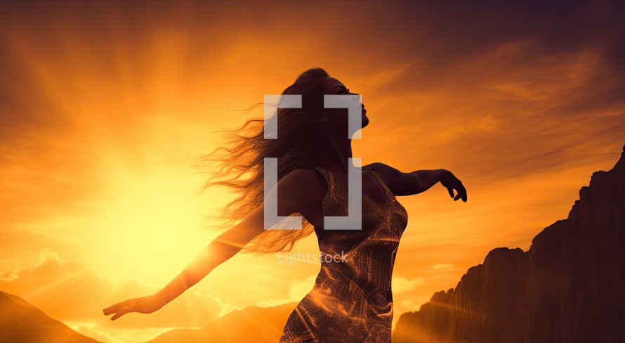 Silhouette of a woman with long hair against sunrise over mountains