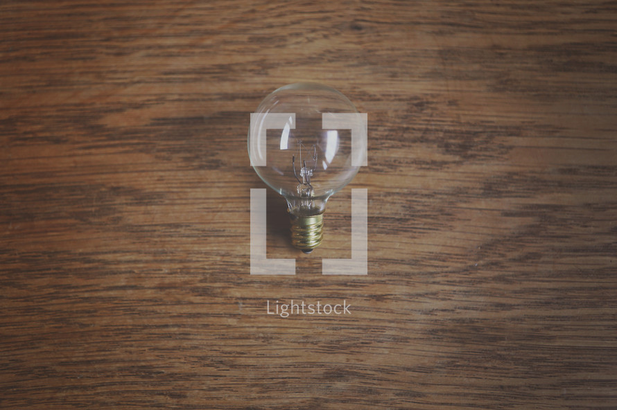 lightbulb on a wood table 