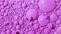 Top view abstract of pink bubbles in paint. Inks, spheres, oil. Colorful shapes. Detailed background, beautiful design, balloons texture. High quality photo
