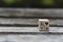 word love on wood block 