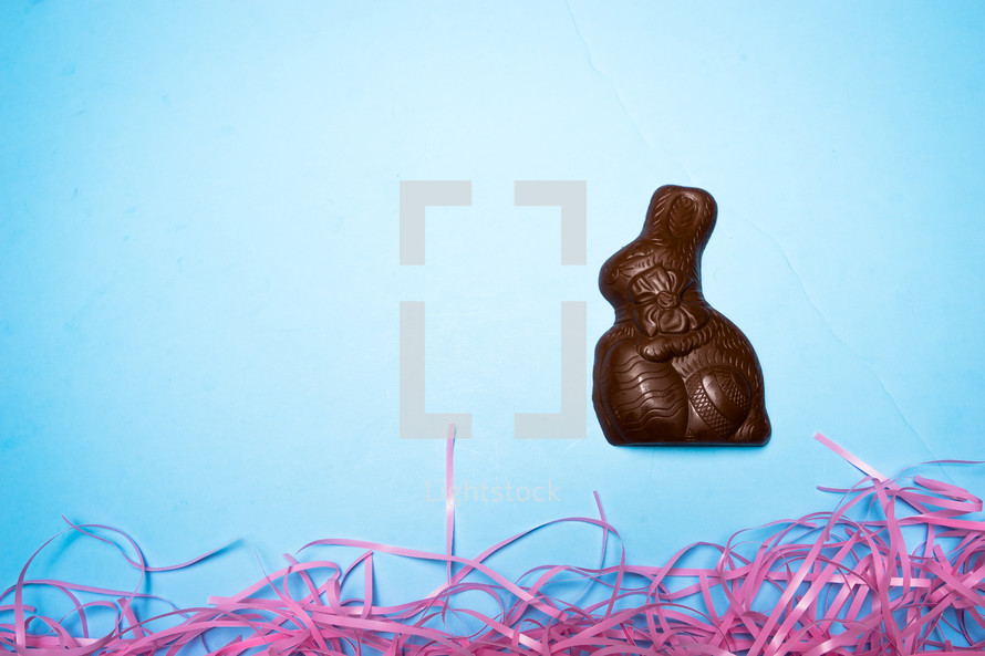 Chocolate Easter rabbit over a blue background 