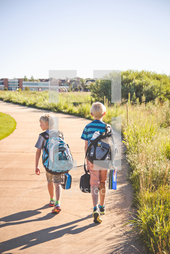 two boys walking to school 