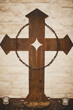 crown of thorns hanging on a cross