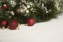 glittery Christmas ornaments and Christmas tree on a white background 