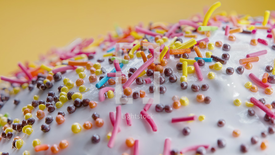 Easter cake decoration with colorful decorative sprinkles on studio background. Homemade cake, christian festive bakery, tradition. Spring religious holiday . High quality