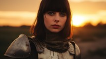 Joan of Arc, God's Warrior. Short haired young woman in armor at sunset