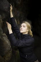 a woman rocky climbing 