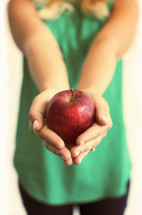 teacher holding an apple