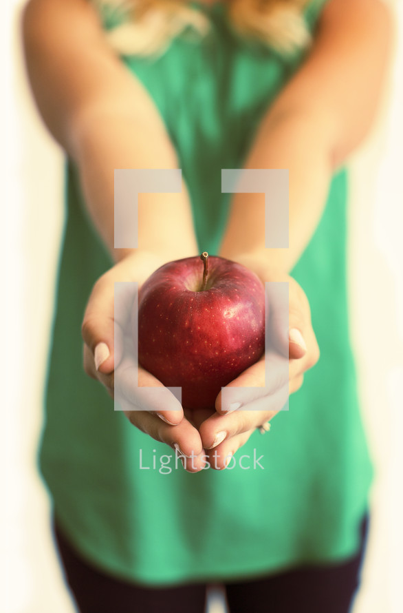 teacher holding an apple