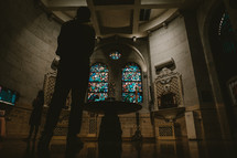 people praying in a chapel 