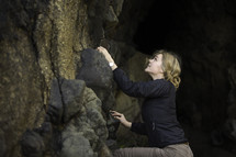 a woman rock climbing 