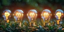 Illuminated light bulbs on lush green grass symbolizing innovative ideas