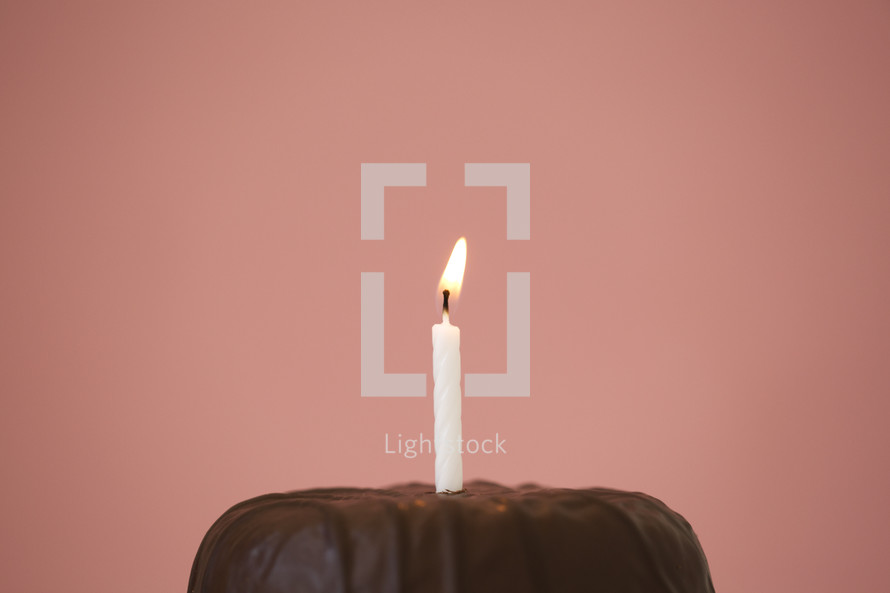 birthday candle on a chocolate cake 