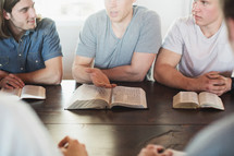 men reading Bibles at a men's group Bible study 