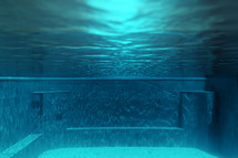 under water in a swimming pool 
