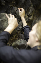 a woman rock climbing 