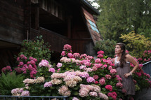 woman standing in a flower garden 