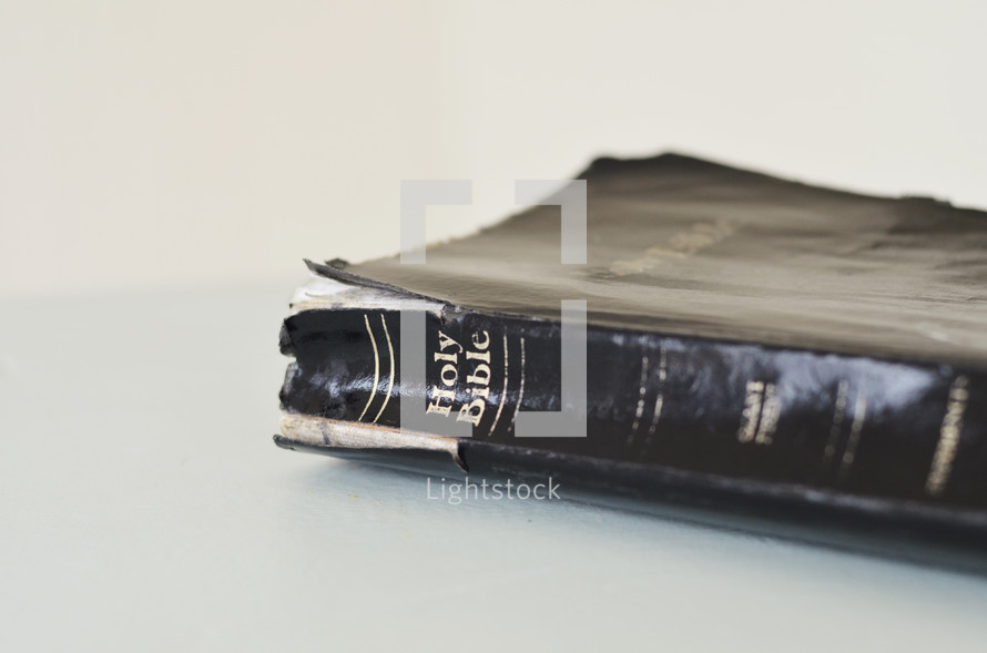 A well used Bible with broken binding.