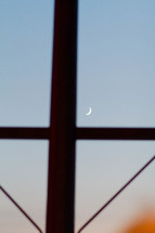 crescent moon through a window 