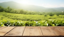Wooden table top on green tea plantation background. For product display