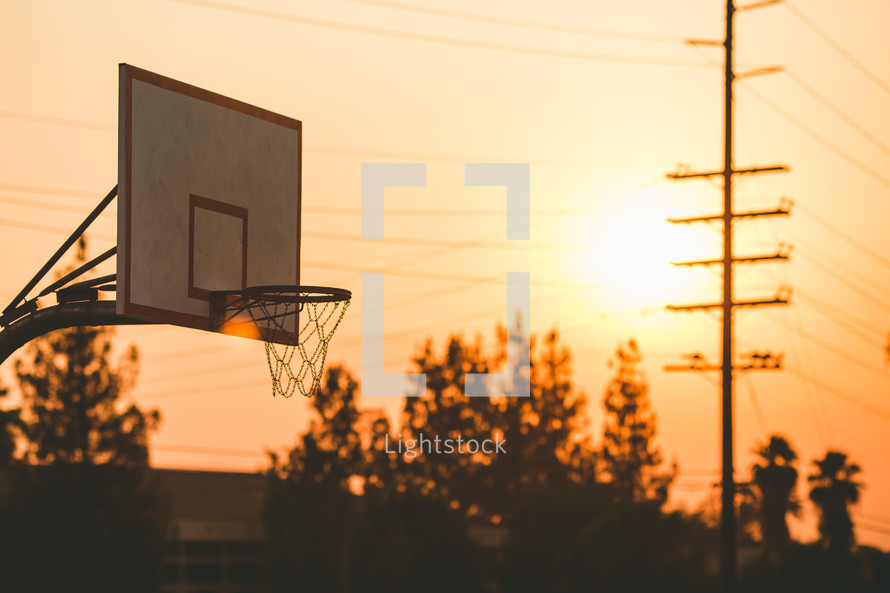 basketball goal at sunset 