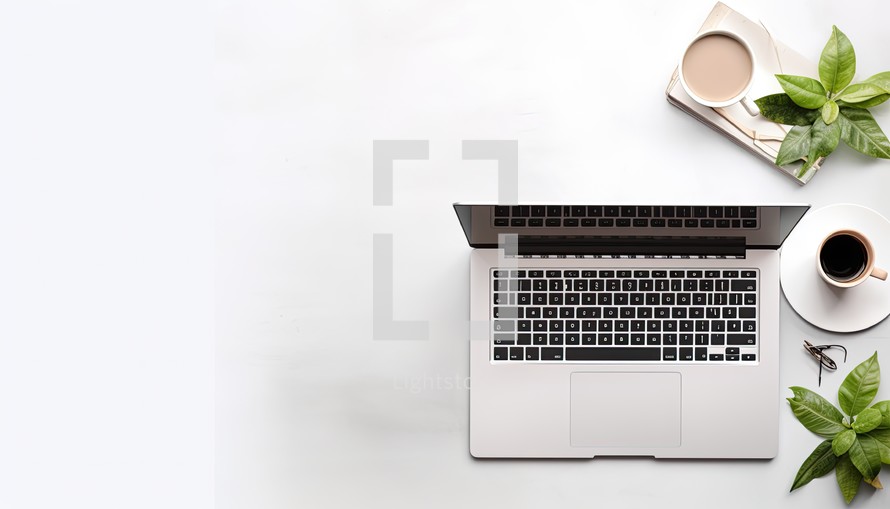 Laptop computer with coffee cup and plant on white background, top view