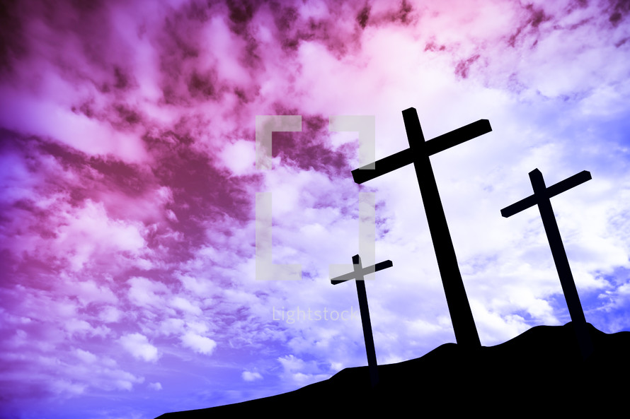 silhouettes of three crosses at sunrise 