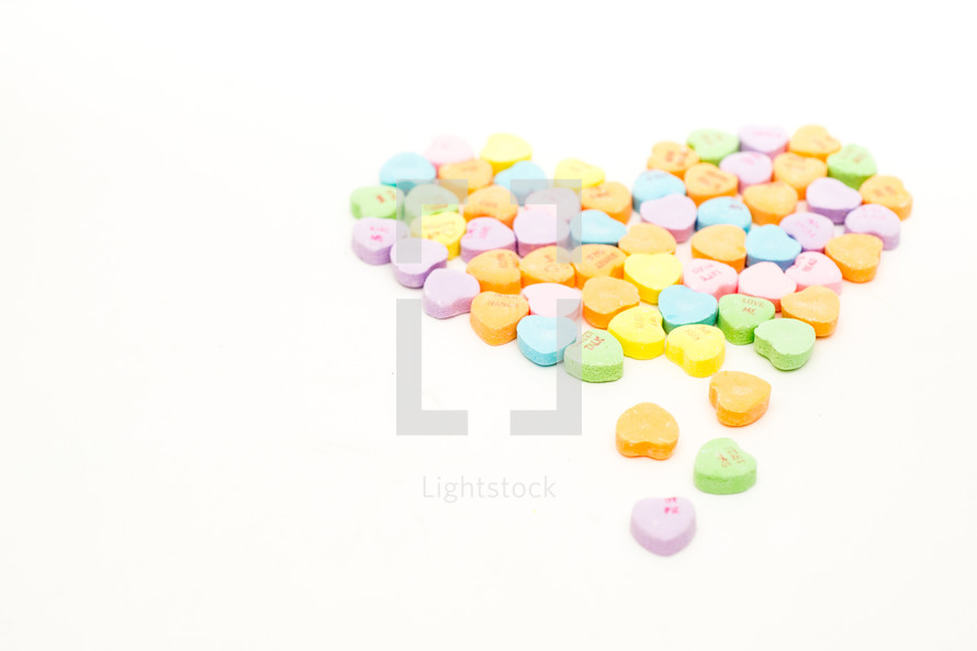 Candy hearts in a heart shape.