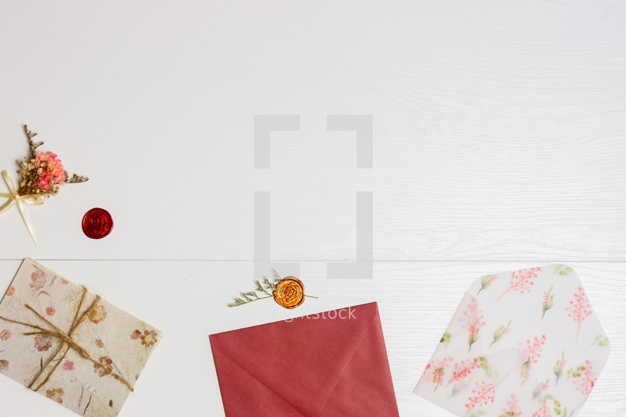 flowers, stationary and envelopes on a white background 