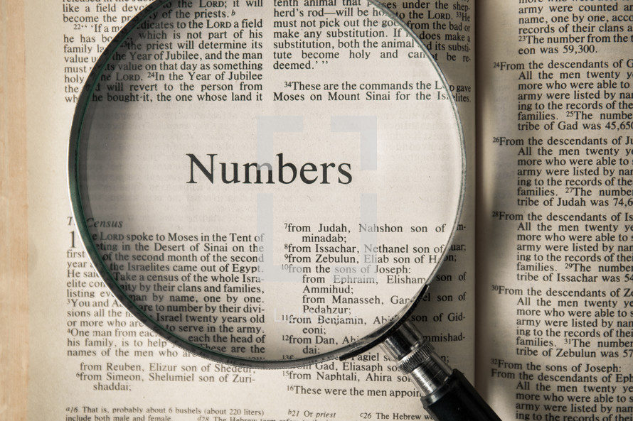 magnifying glass over Bible - Numbers 