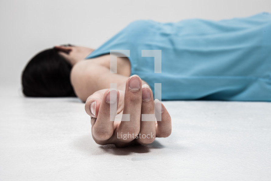 a woman lying on the ground 