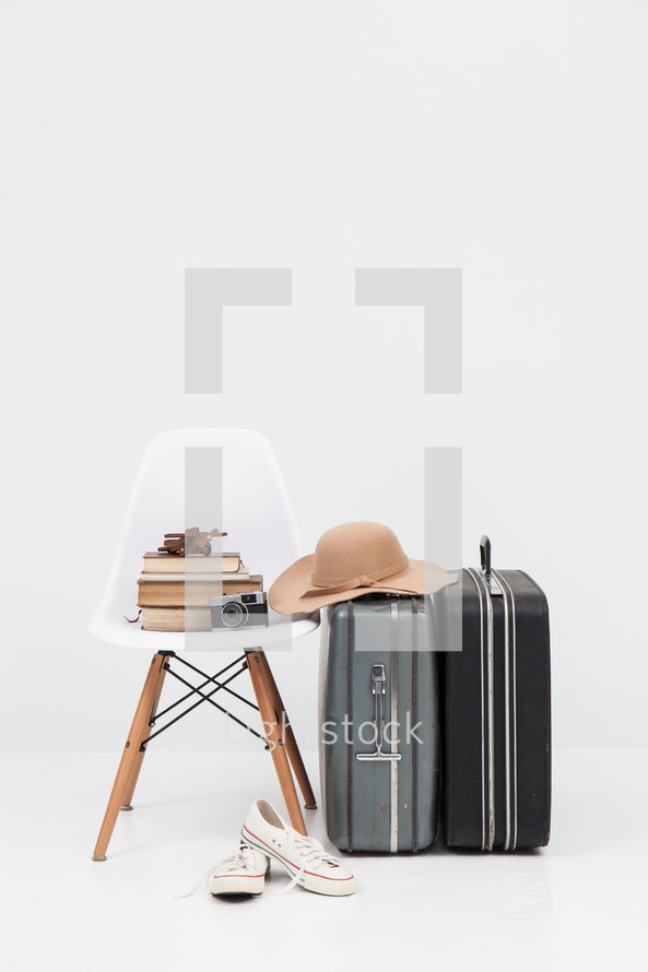 suitcase, luggage, sunhat, sneakers, shoes, wooden plane, chair, books, camera, trip, travel, vacation 