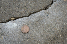 penny on the sidewalk