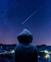 person watching a shooting star 