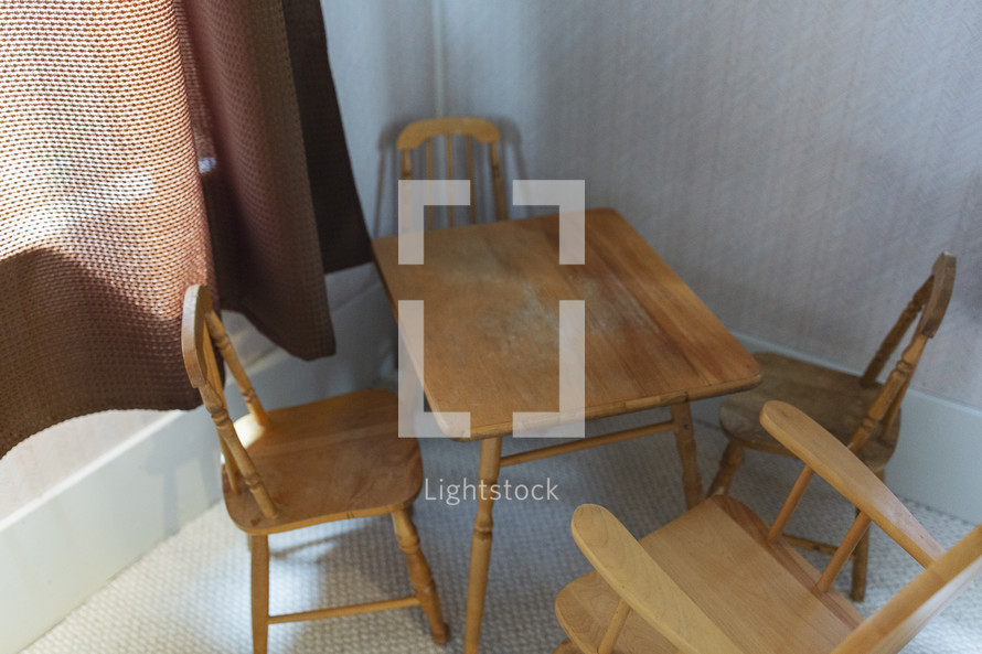 little wooden chairs and table