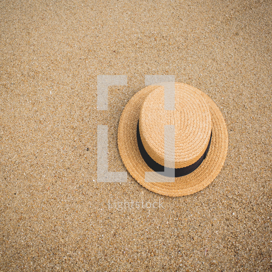 a hat on sand 