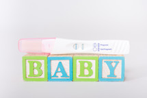 baby blocks and positive pregnancy test 