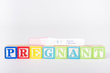pregnant blocks and a positive pregnancy test 