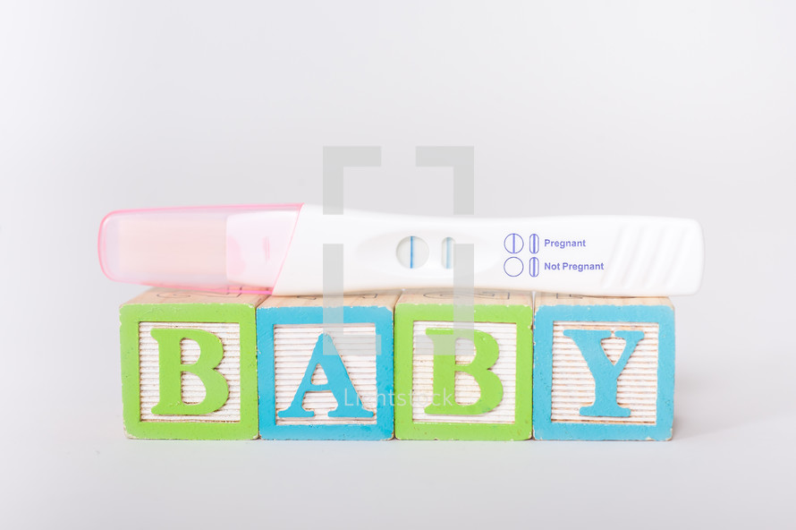 baby blocks and positive pregnancy test 