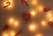 Twinkle lights under fake snowy backdrop with candy canes