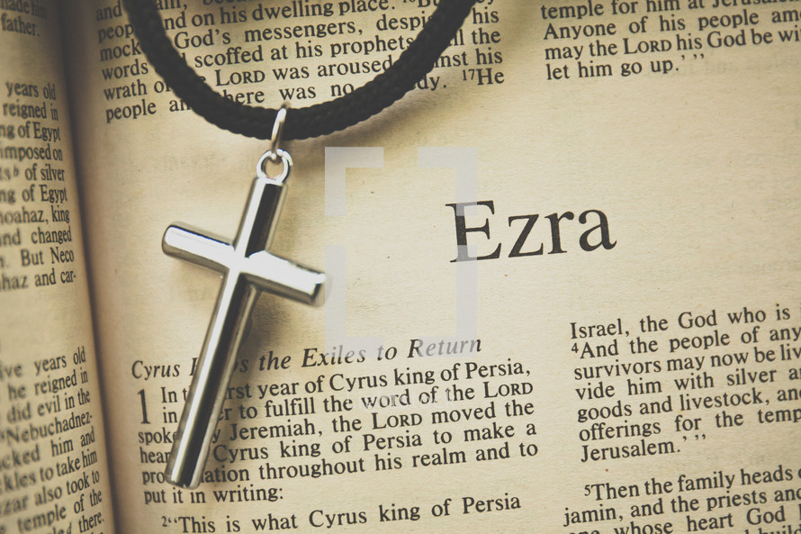 Ezra and a cross necklace 