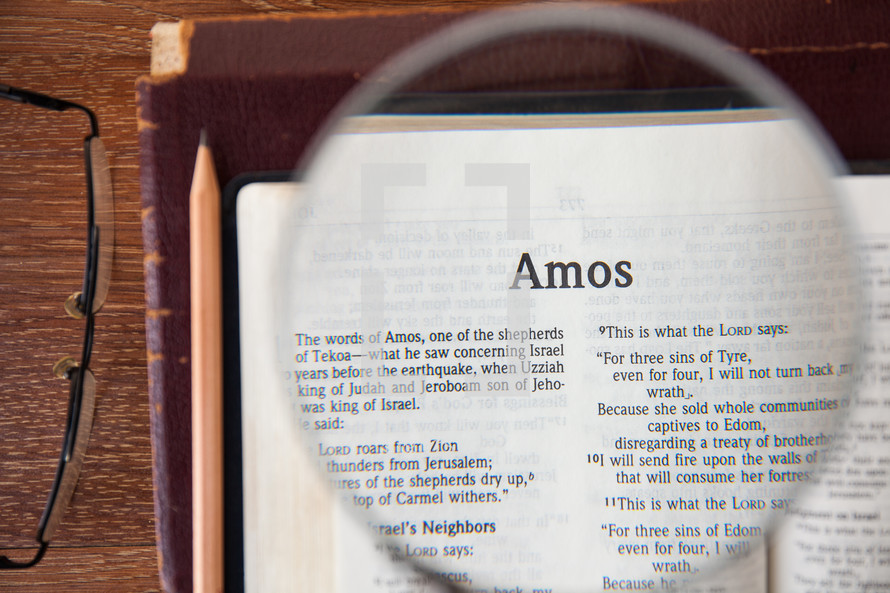 magnifying glass over Amos