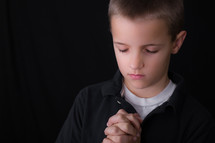 A boy child praying 