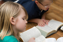 children reading Bibles 