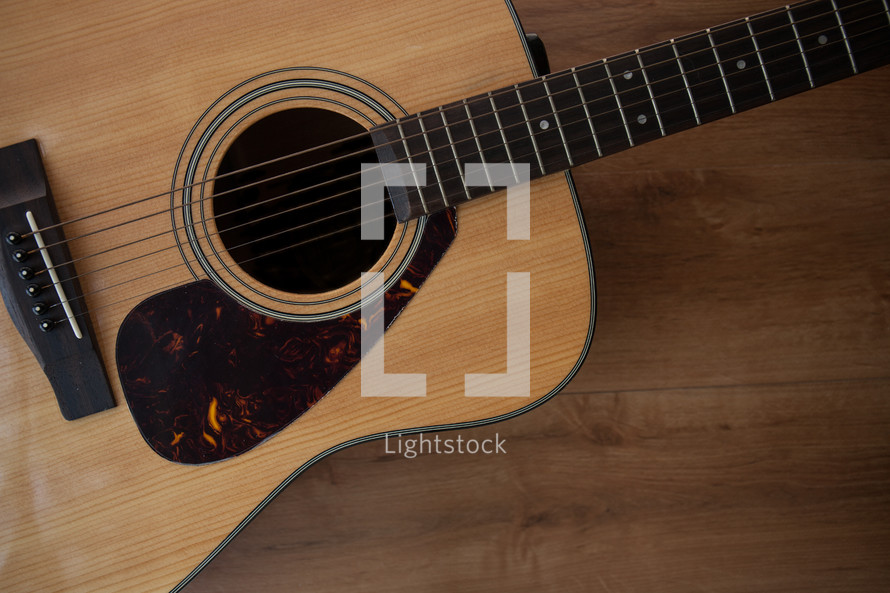 acoustic guitar on wood 