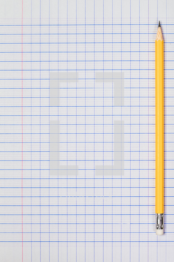 sharpened pencil on graph paper 